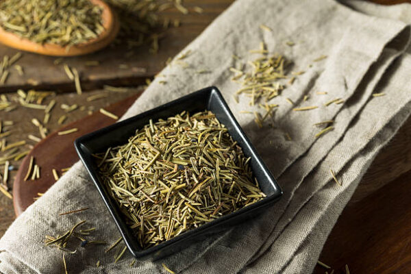 Raw dry organic rosemary seasoning ready for cooking